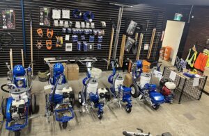 storefront of pavement depot canada graco line painters on display lutes rakes and squeegees hanging on the wall