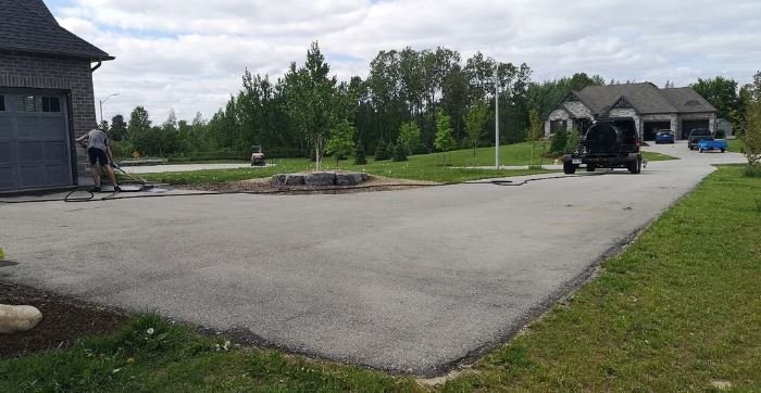 large residential driveway with rhino pavement about to start sealcoating