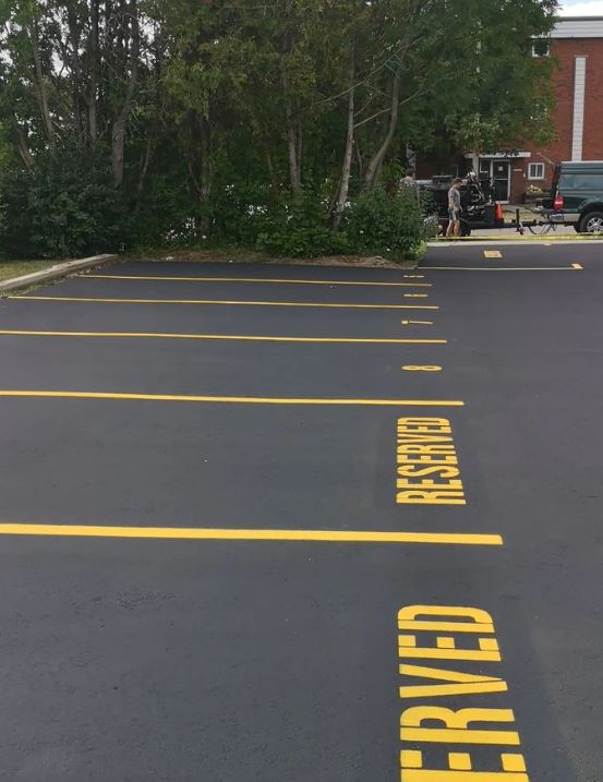 parking lot that has just been sealed with Gemseal Black Diamond LP Emulsion Asphalt Sealer