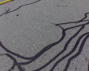 Parking lot cracks sealed with Mcasphalt DF Asphalt Crack Sealer