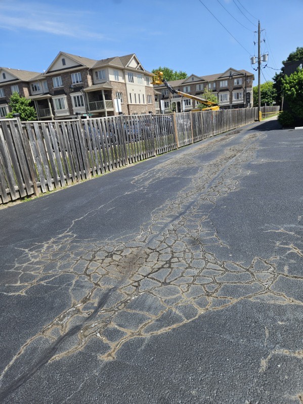 Discoloration of Asphalt Cracks