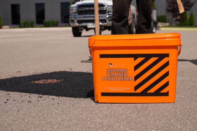 Da-Lee Instarmac Permanent Pothole Repair Bucket on Job Site